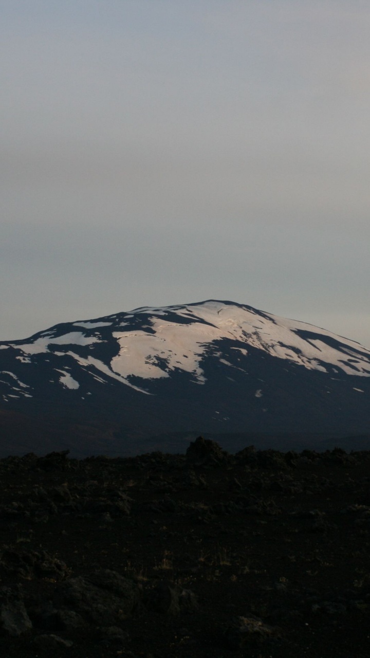 Snow Covered Mountain Under Cloudy Sky During Daytime. Wallpaper in 720x1280 Resolution