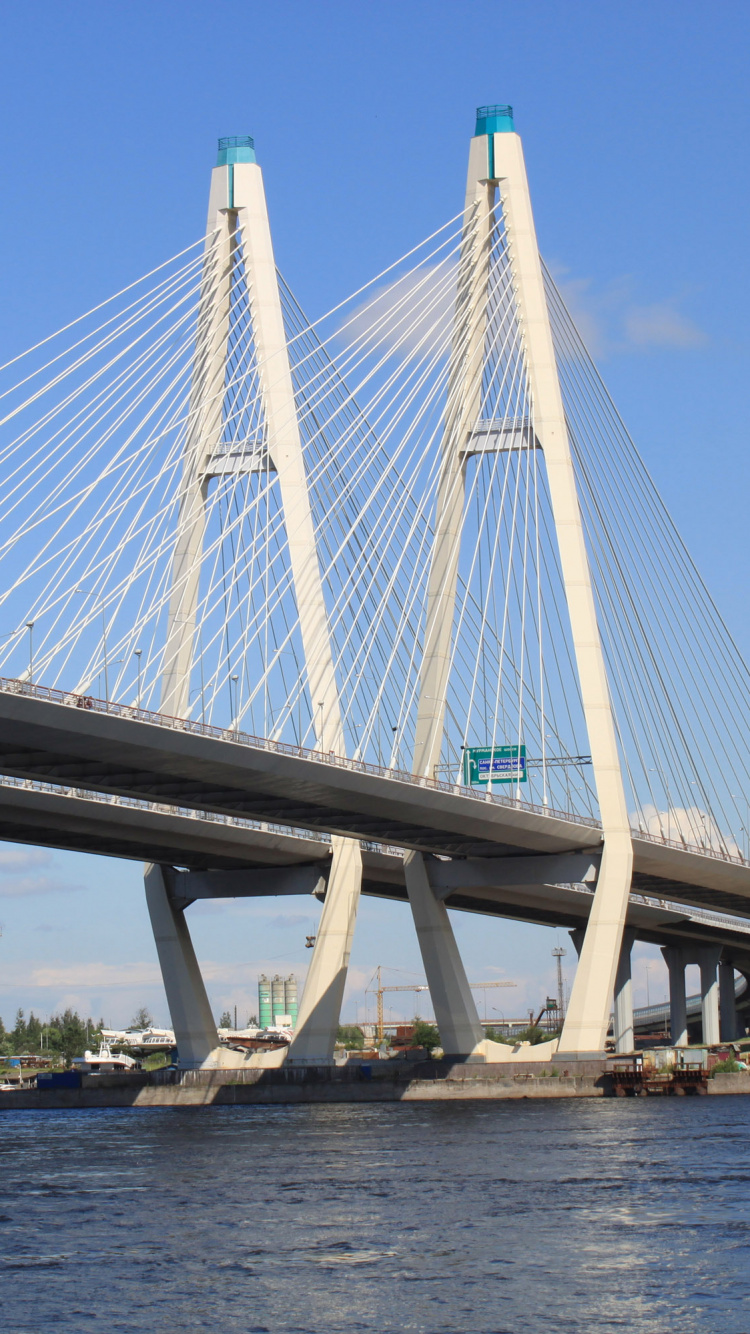 White Bridge Over Body of Water During Daytime. Wallpaper in 750x1334 Resolution