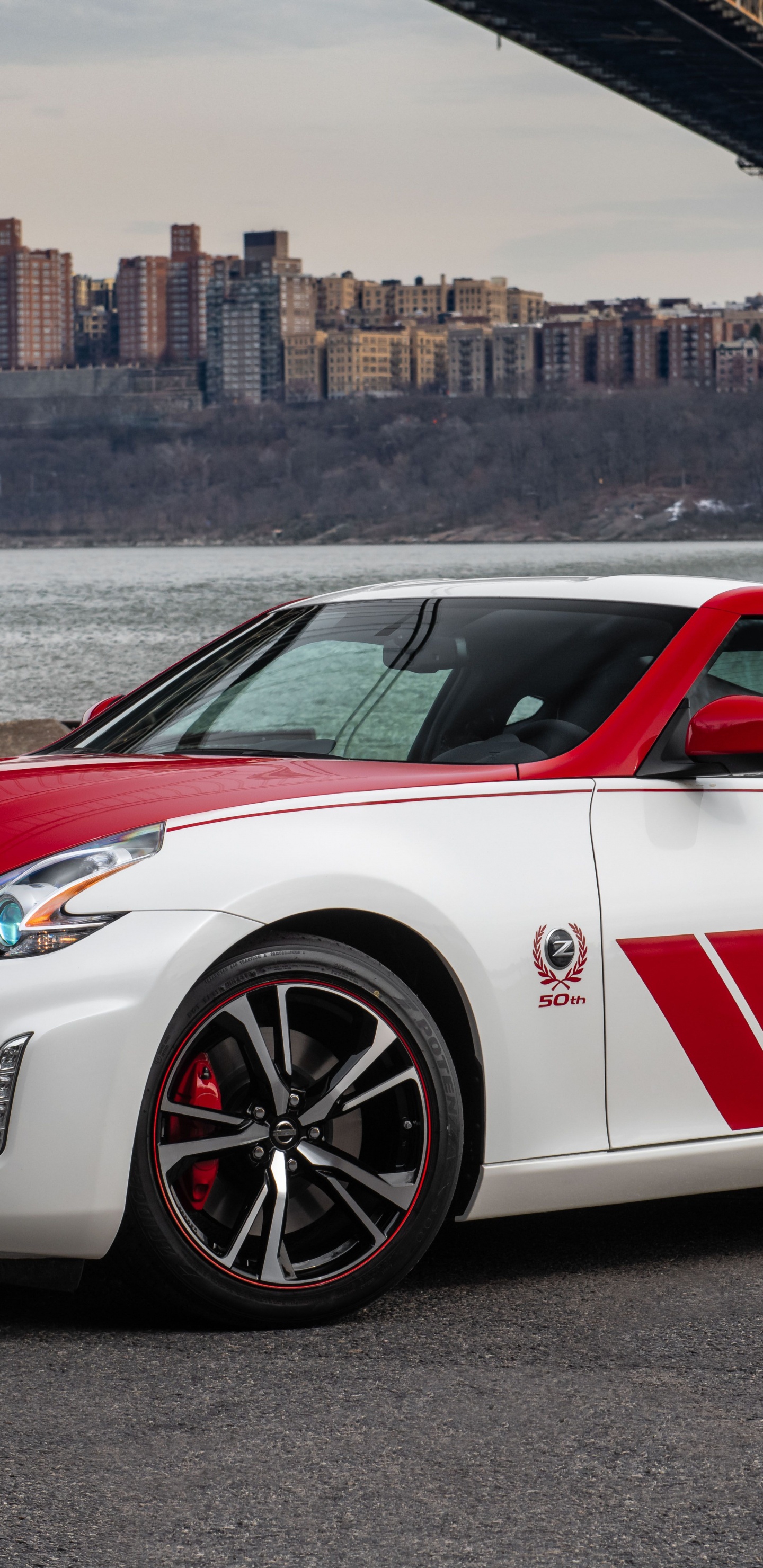 White and Red Porsche 911 Parked on Gray Pavement Near Body of Water During Daytime. Wallpaper in 1440x2960 Resolution