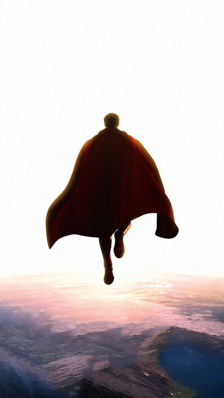 Person in Red Coat Standing on Black Rock Formation During Daytime. Wallpaper in 750x1334 Resolution