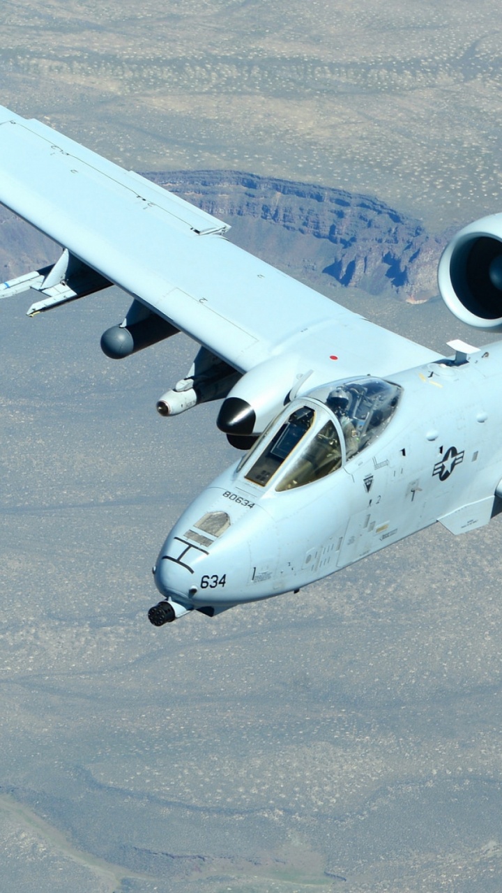 White and Blue Airplane on Gray Sand During Daytime. Wallpaper in 720x1280 Resolution