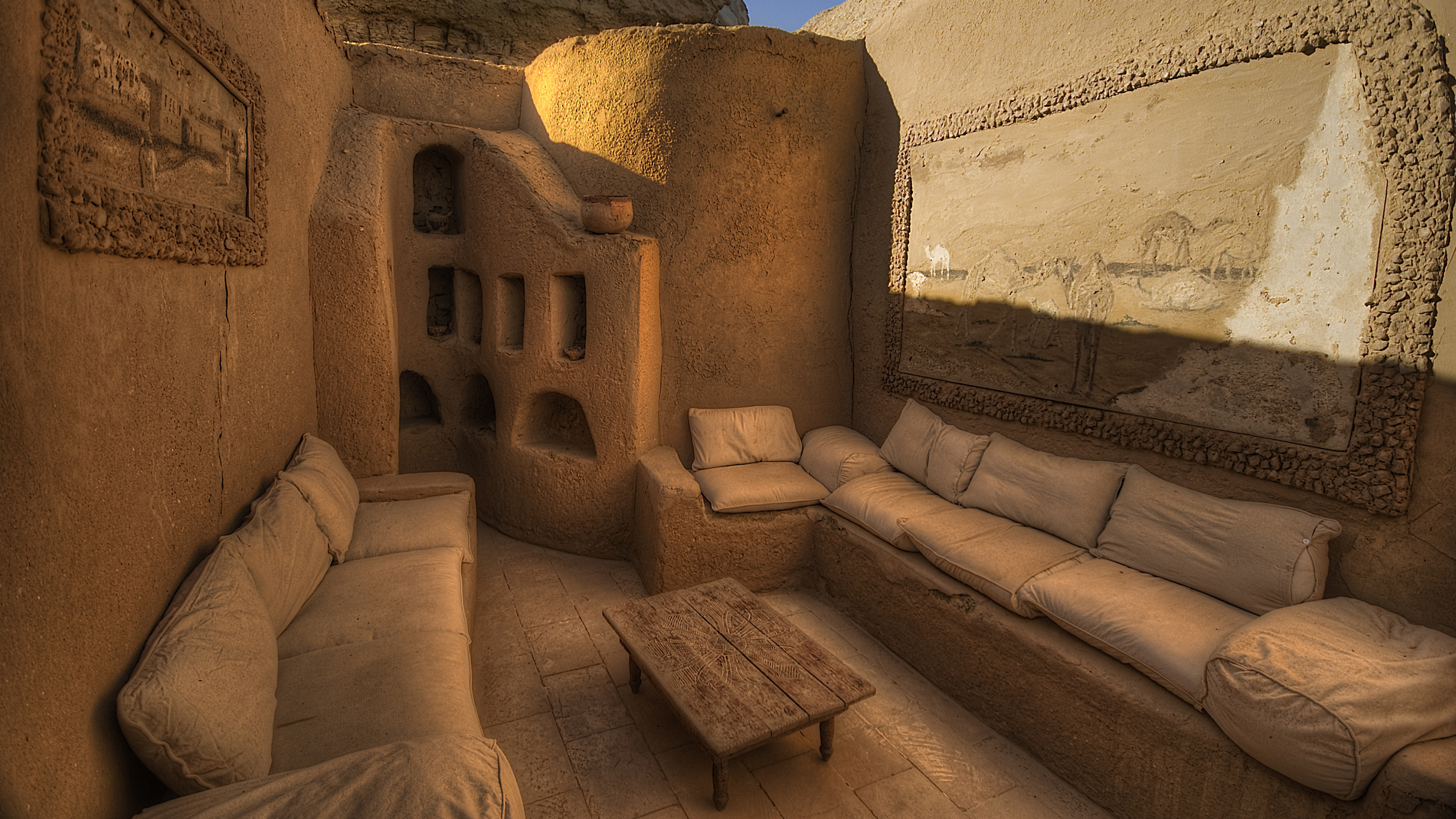 Brown Concrete Building Under Blue Sky During Daytime. Wallpaper in 2560x1440 Resolution