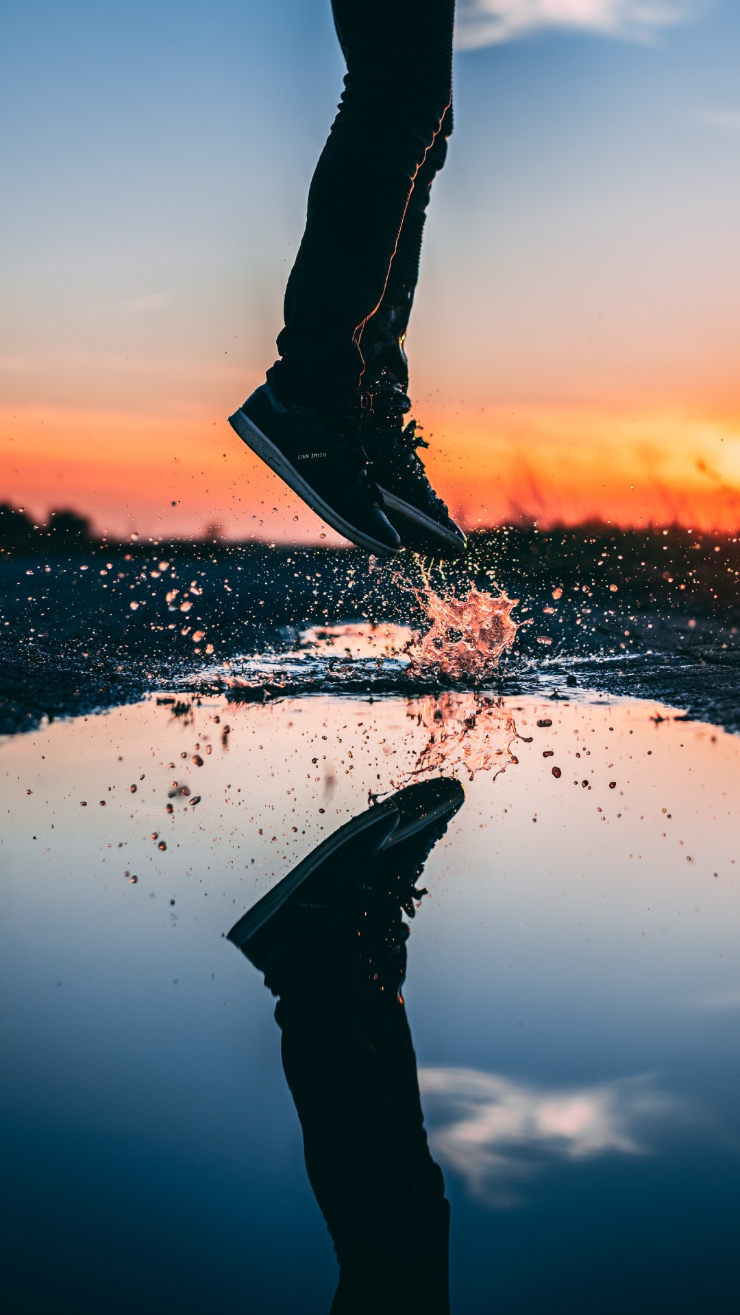 Person in Black Pants Standing on White Sand During Sunset. Wallpaper in 1080x1920 Resolution