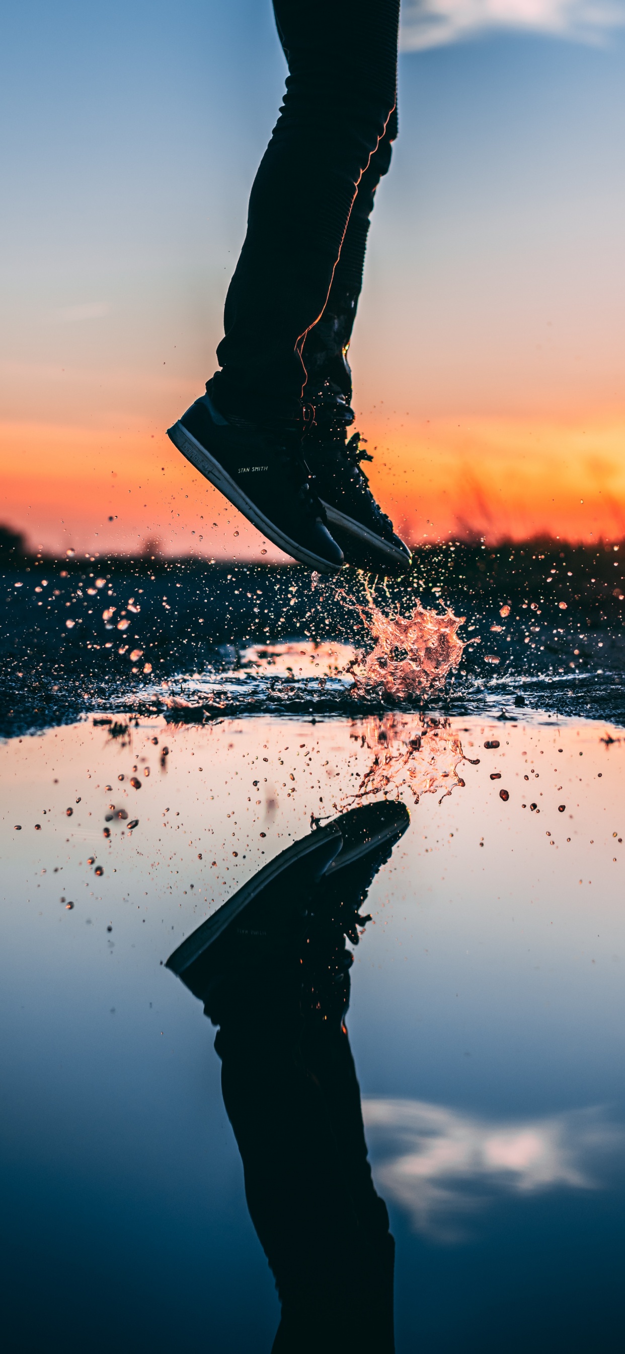 Person in Black Pants Standing on White Sand During Sunset. Wallpaper in 1242x2688 Resolution