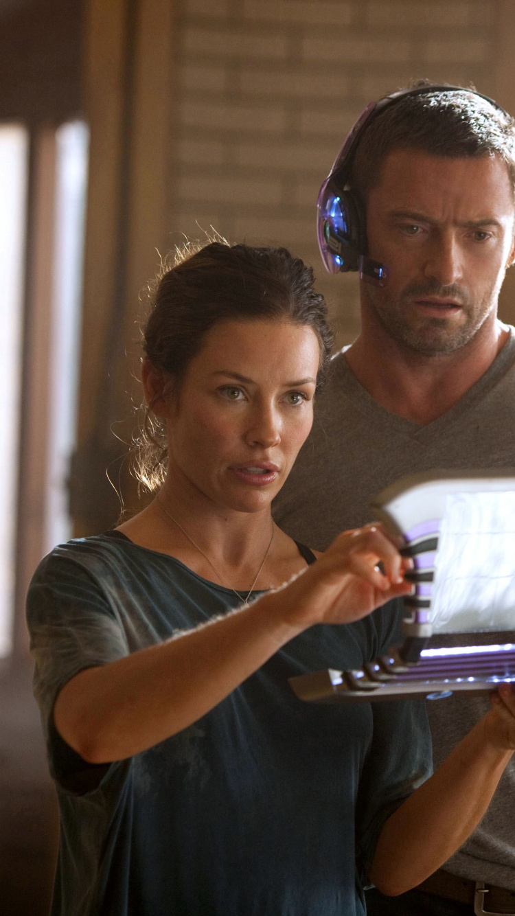 Woman in Black Tank Top Holding White Tablet Computer. Wallpaper in 750x1334 Resolution