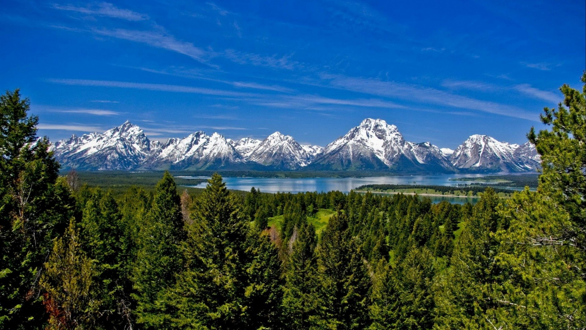 Green Trees Near Snow Covered Mountain Under Blue Sky During Daytime. Wallpaper in 1920x1080 Resolution