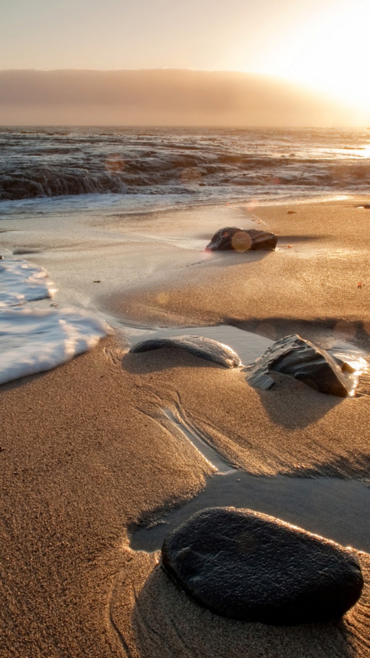 Brown Sand Near Body of Water During Daytime. Wallpaper in 720x1280 Resolution