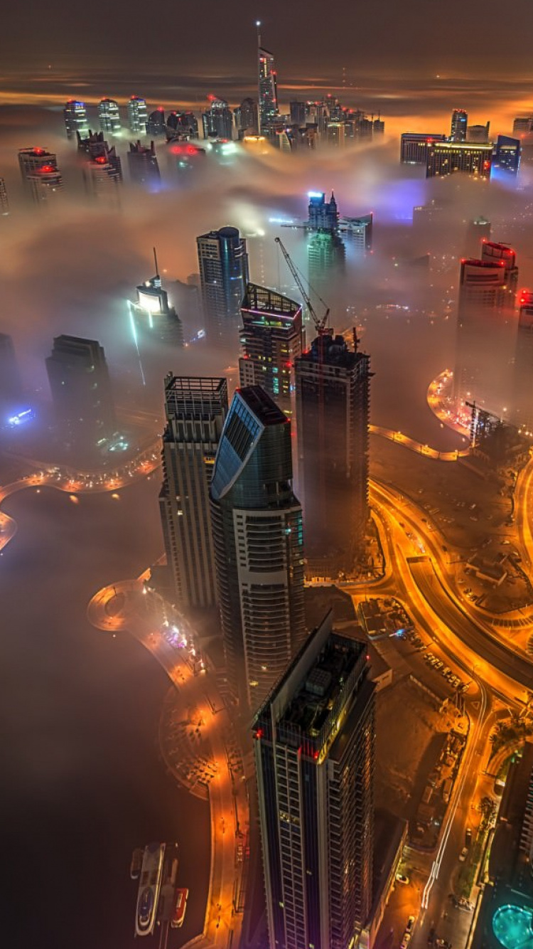 Hochhäuser in Der Nacht. Wallpaper in 750x1334 Resolution