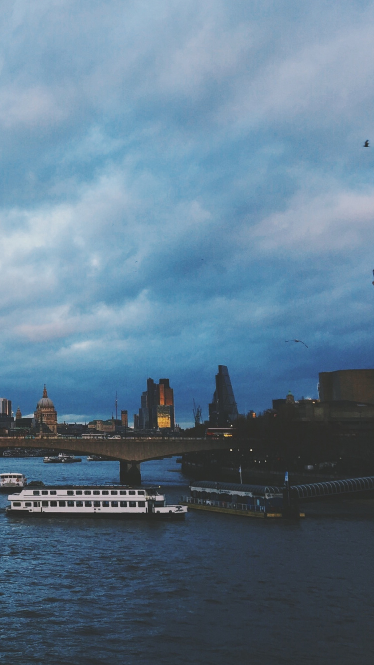 White and Black Boat on Water Under Blue Sky During Daytime. Wallpaper in 750x1334 Resolution
