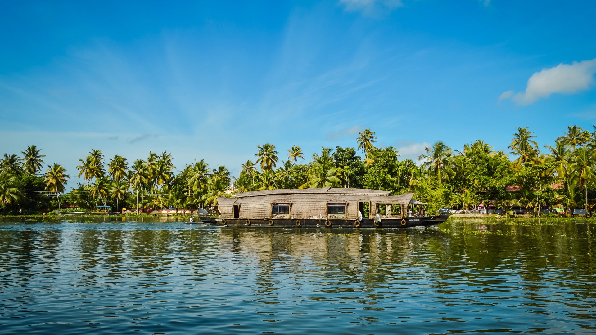 White and Brown House Beside Lake During Daytime. Wallpaper in 1920x1080 Resolution