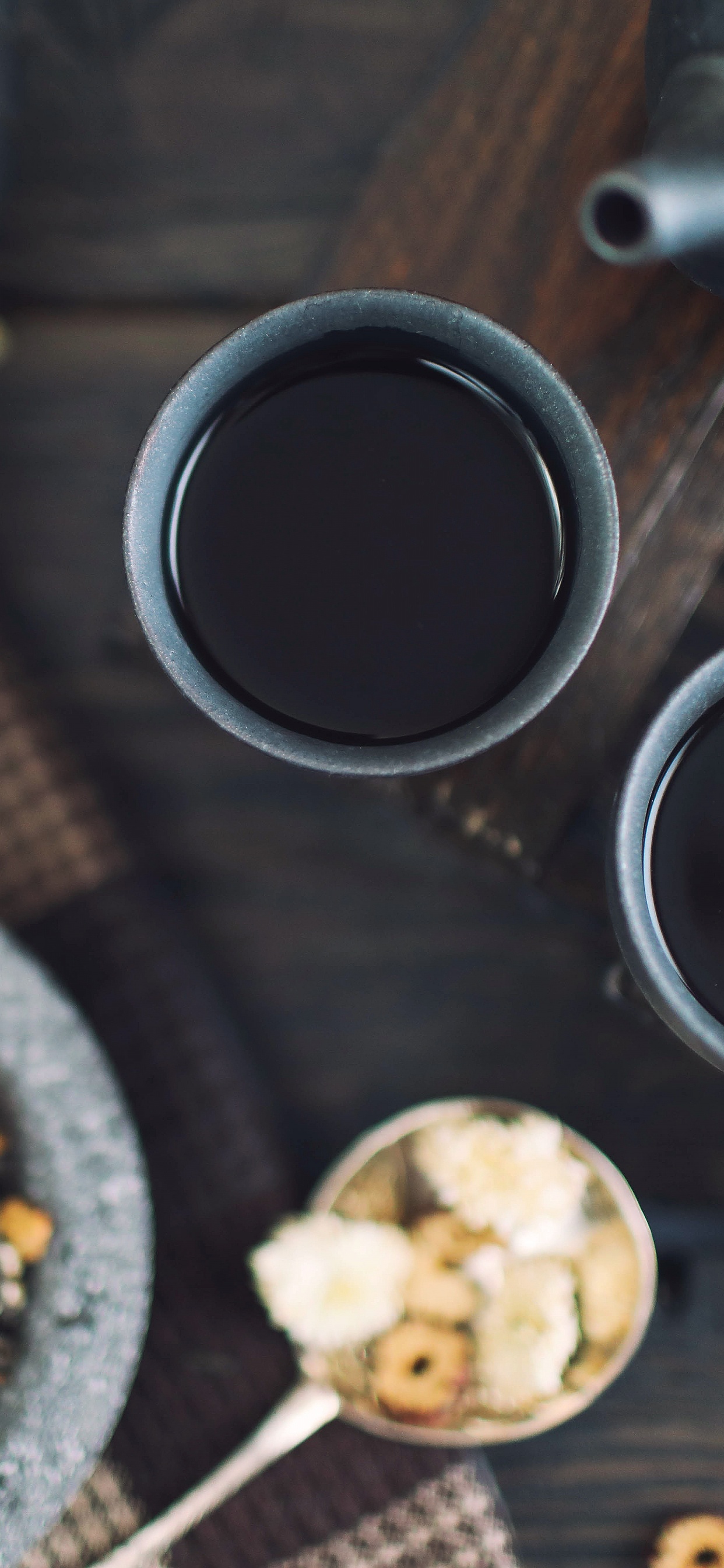 Black Ceramic Mug on Brown Wooden Table. Wallpaper in 1242x2688 Resolution