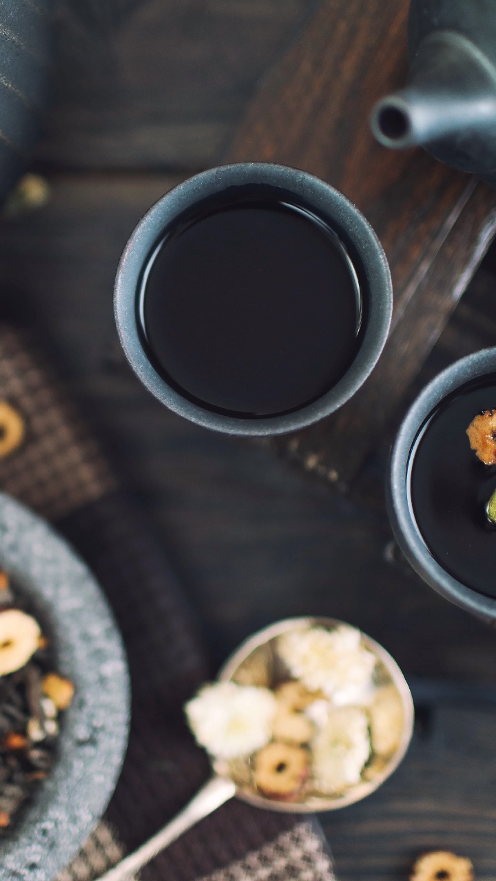 Black Ceramic Mug on Brown Wooden Table. Wallpaper in 720x1280 Resolution