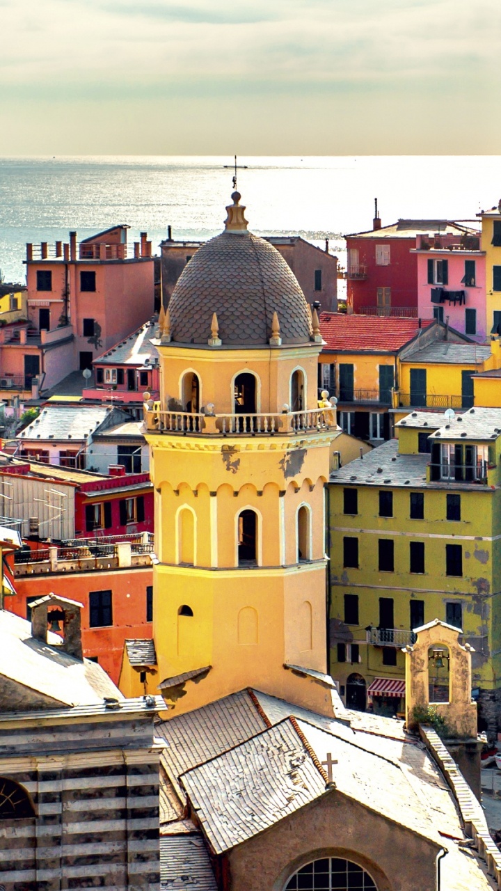 Yellow and Brown Concrete Building Under White Clouds During Daytime. Wallpaper in 720x1280 Resolution