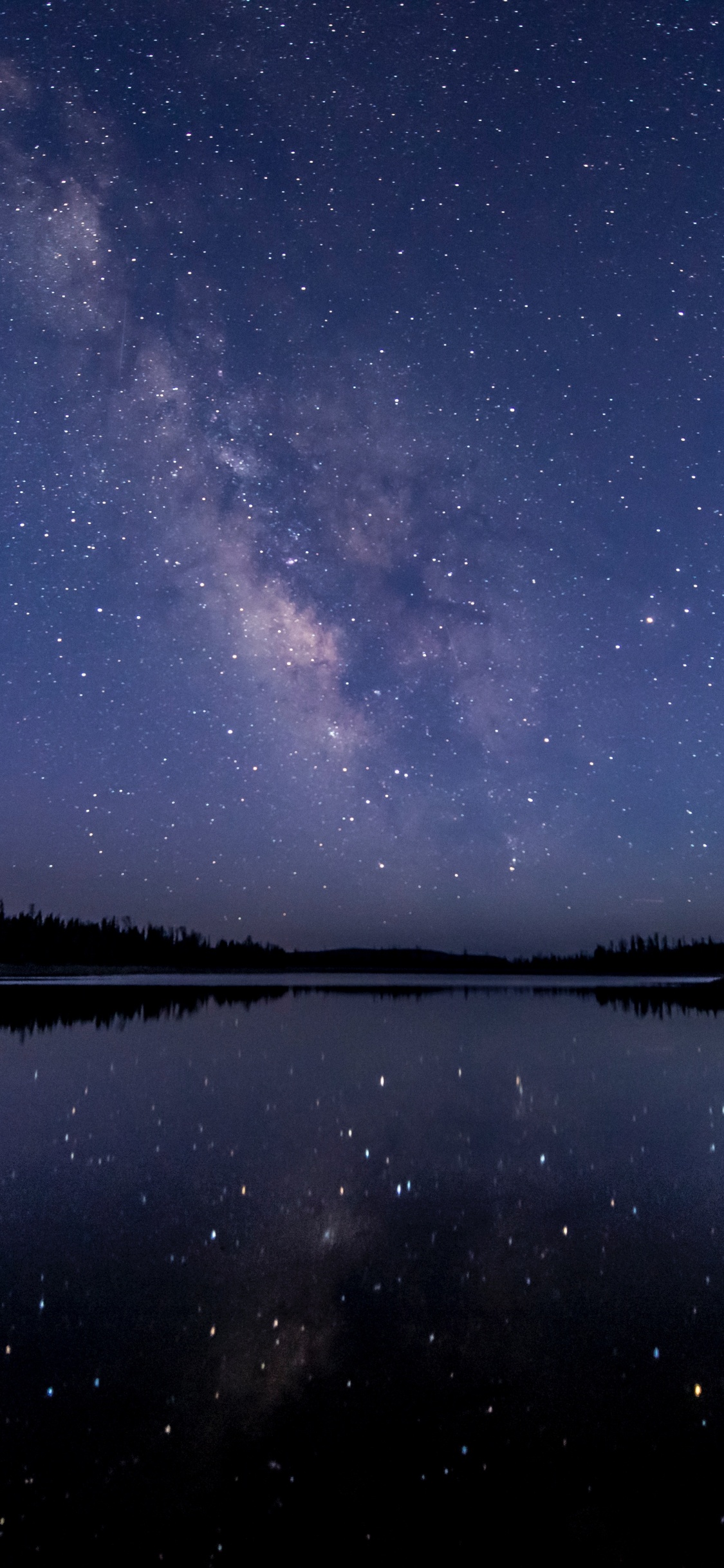 Body of Water Under Blue Sky. Wallpaper in 1125x2436 Resolution