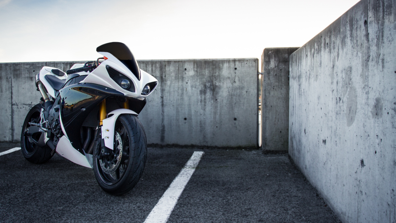 Black and White Sports Bike Parked on Gray Concrete Road During Daytime. Wallpaper in 1280x720 Resolution