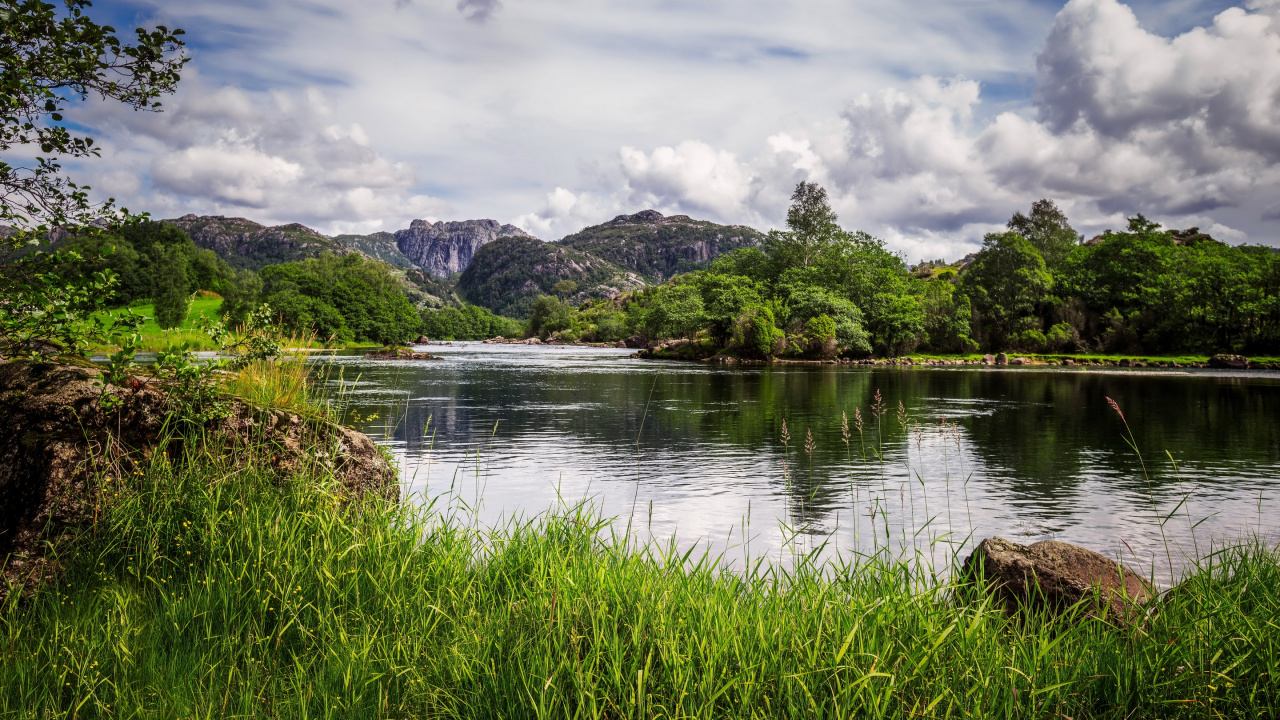 Green Grass Near Lake and Mountain Under White Clouds During Daytime. Wallpaper in 1280x720 Resolution