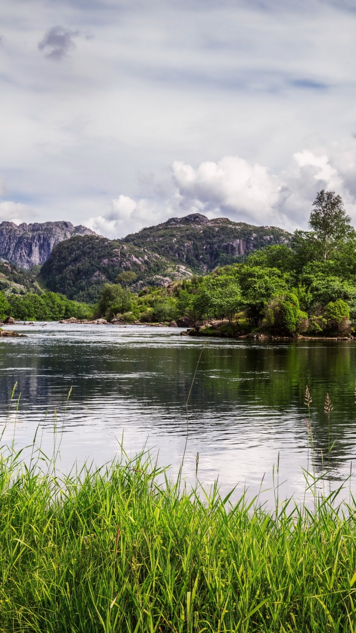 Green Grass Near Lake and Mountain Under White Clouds During Daytime. Wallpaper in 720x1280 Resolution