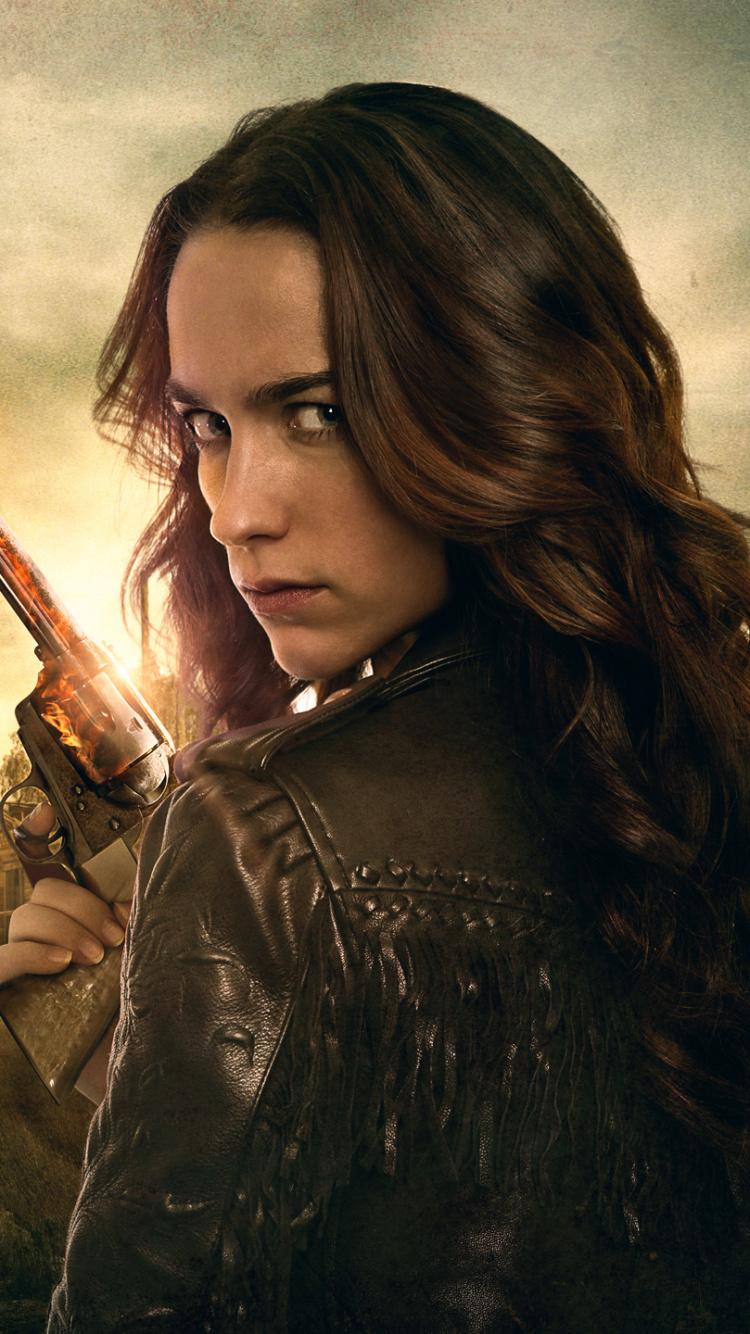 Woman in Black Leather Jacket Holding Brown Stick. Wallpaper in 750x1334 Resolution