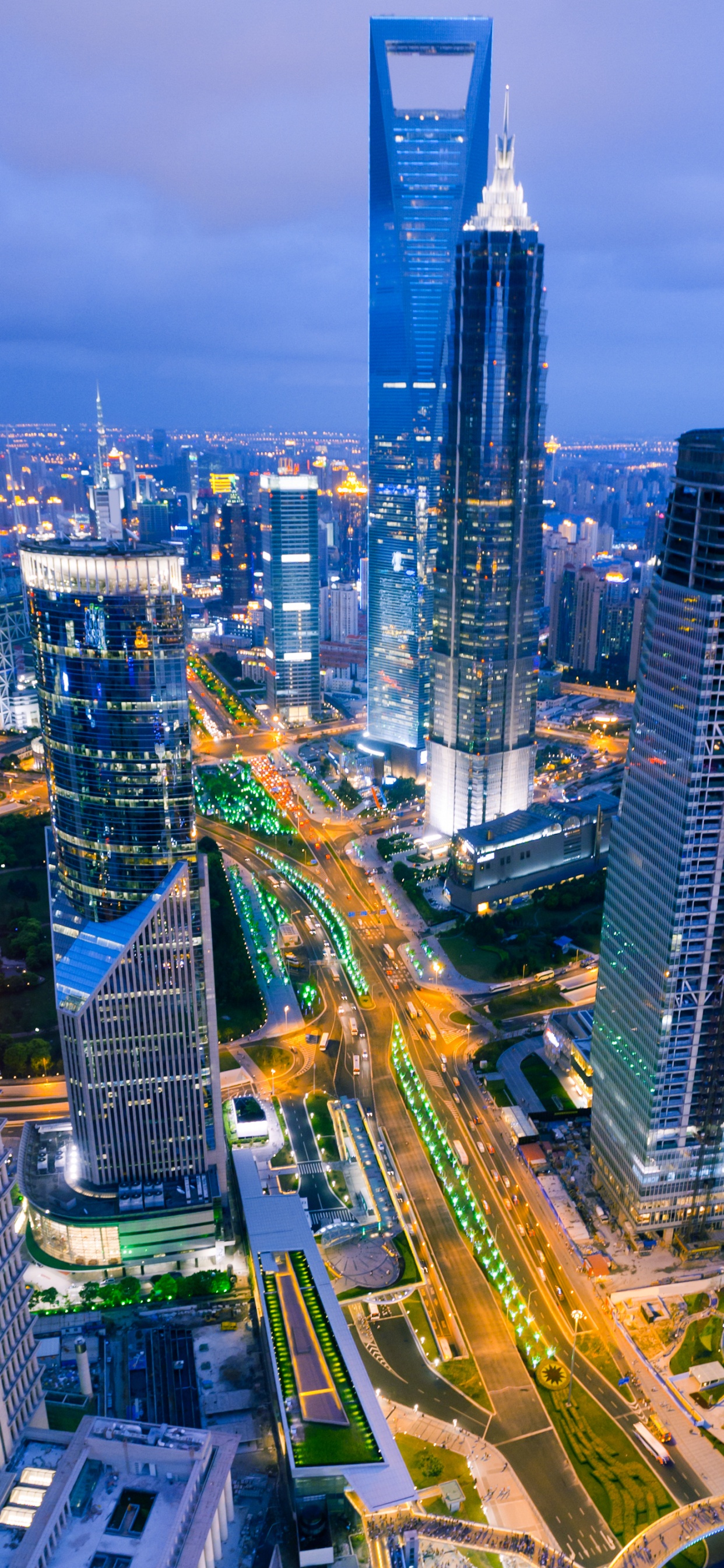 Aerial View of City Buildings During Night Time. Wallpaper in 1242x2688 Resolution