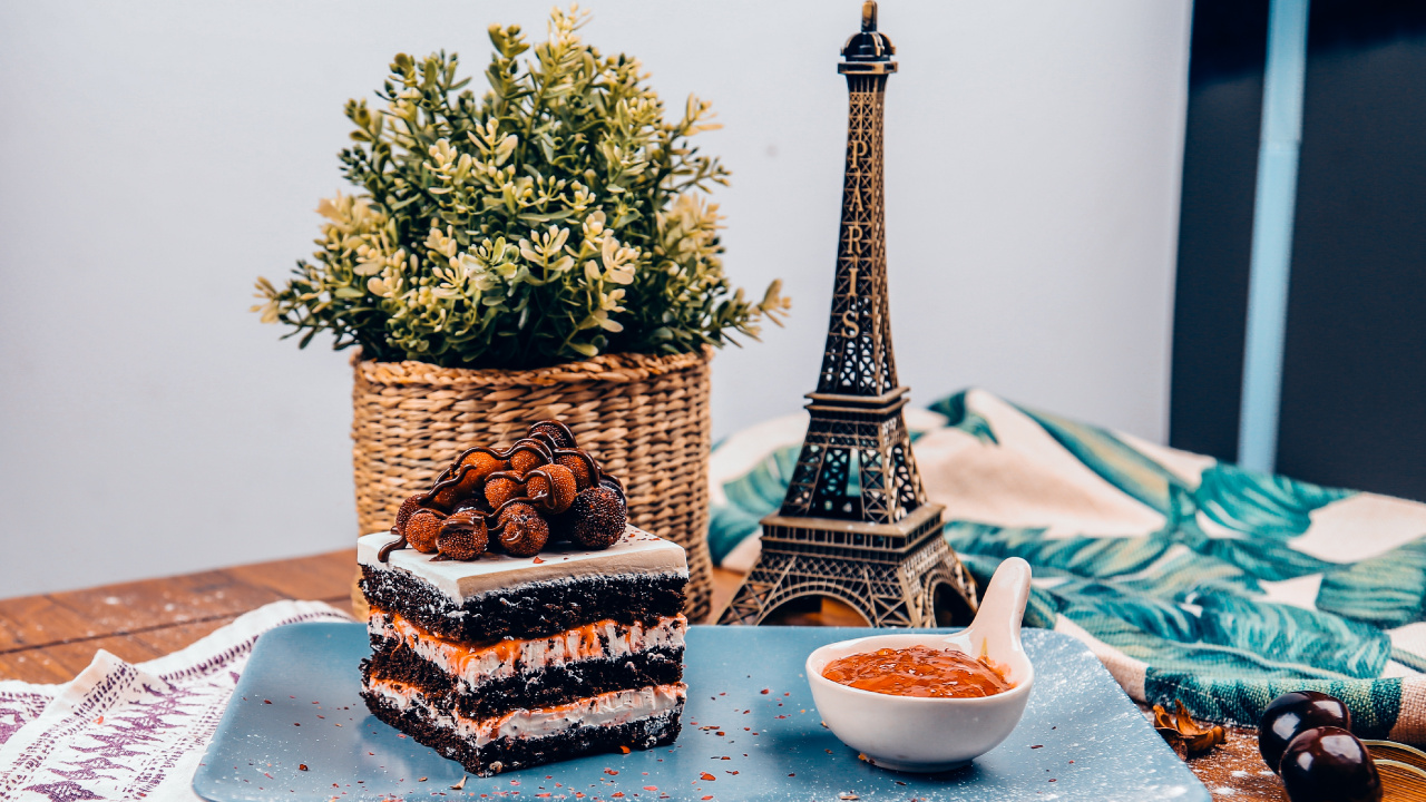 Brown and Black Pine Cone on Blue Ceramic Plate. Wallpaper in 1280x720 Resolution