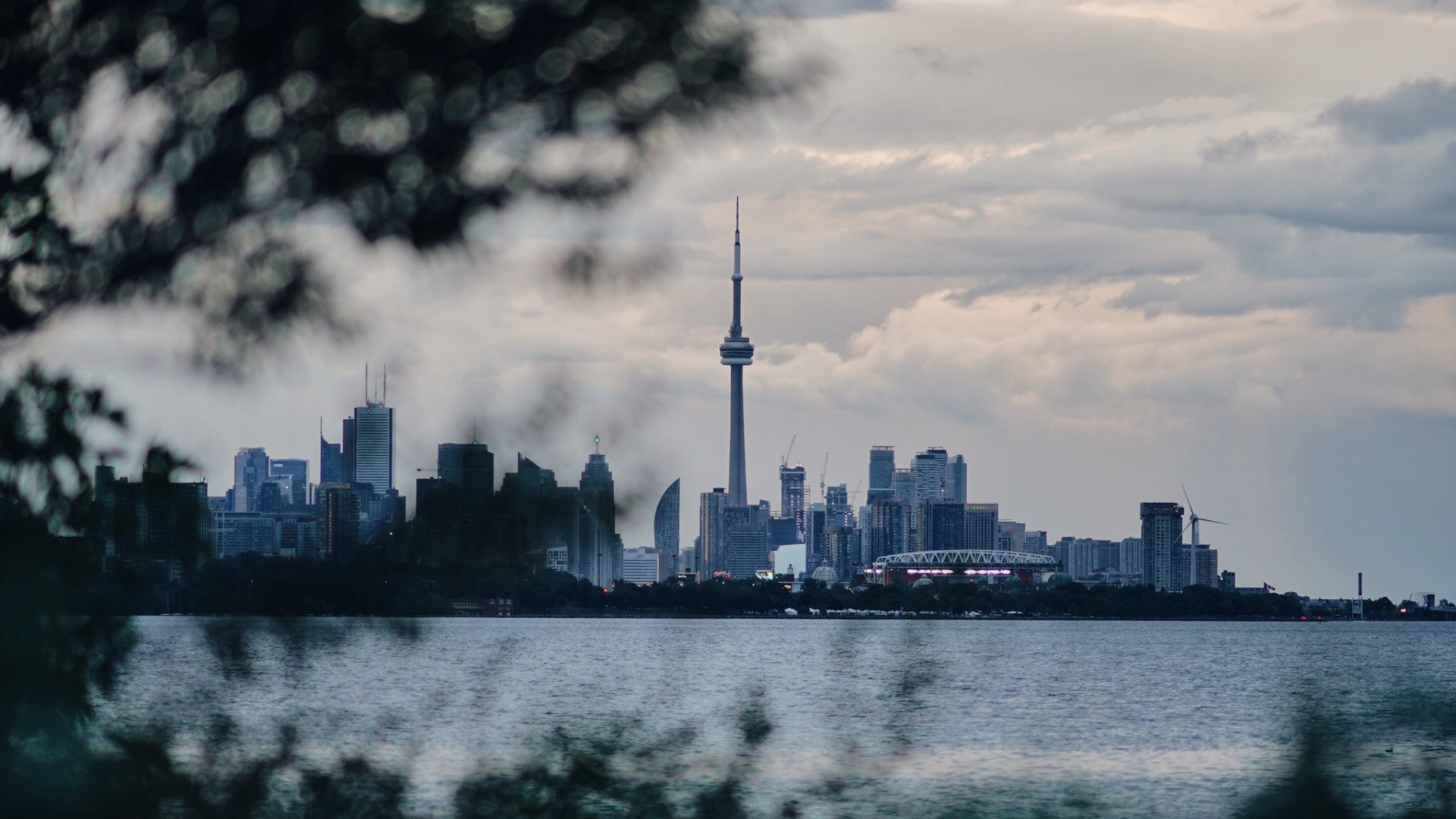 City Skyline Across Body of Water During Daytime. Wallpaper in 1920x1080 Resolution