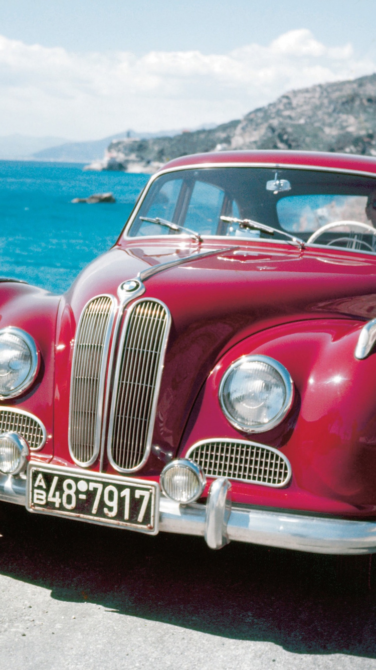 Red Classic Car on Beach During Daytime. Wallpaper in 750x1334 Resolution