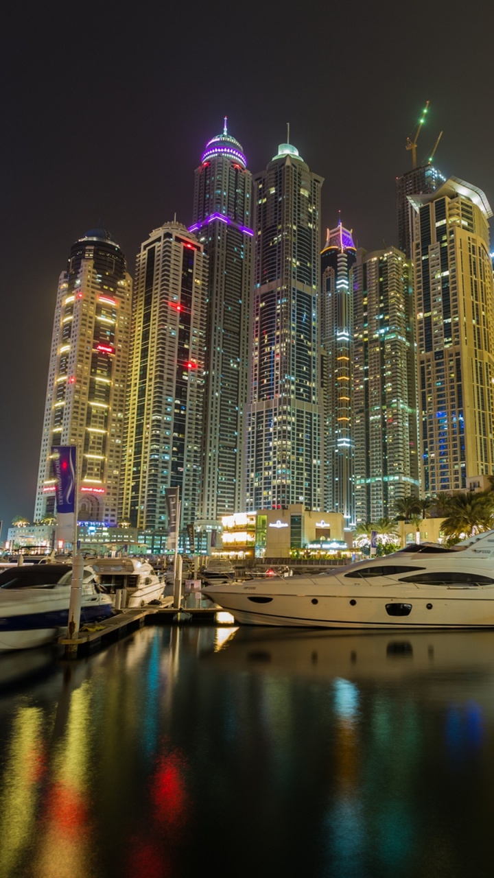 White Boat on Dock During Night Time. Wallpaper in 720x1280 Resolution