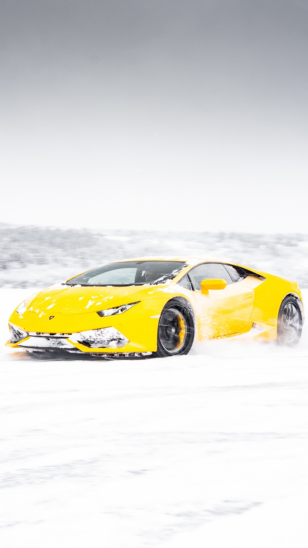 Yellow Ferrari 458 Italia on Snow Covered Ground. Wallpaper in 1080x1920 Resolution
