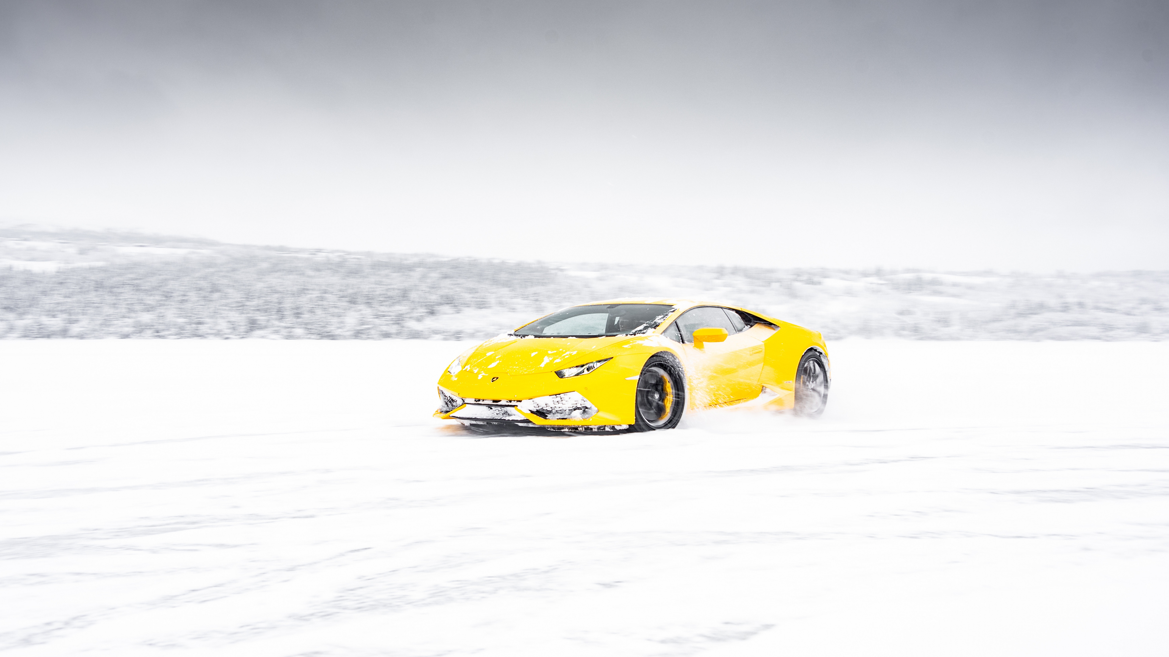 Yellow Ferrari 458 Italia on Snow Covered Ground. Wallpaper in 3840x2160 Resolution