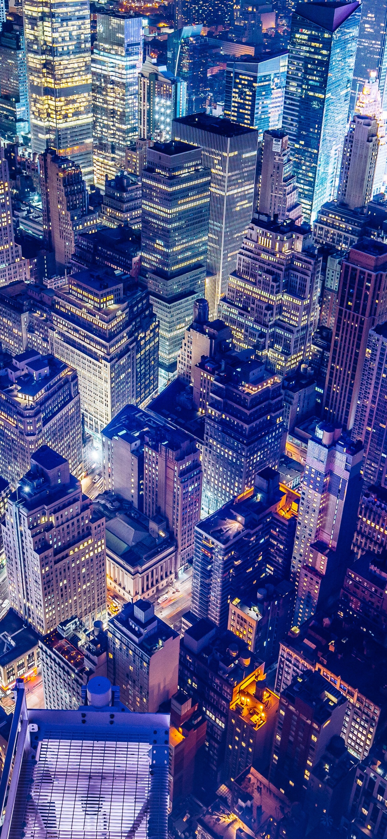 Aerial View of City Buildings During Night Time. Wallpaper in 1242x2688 Resolution