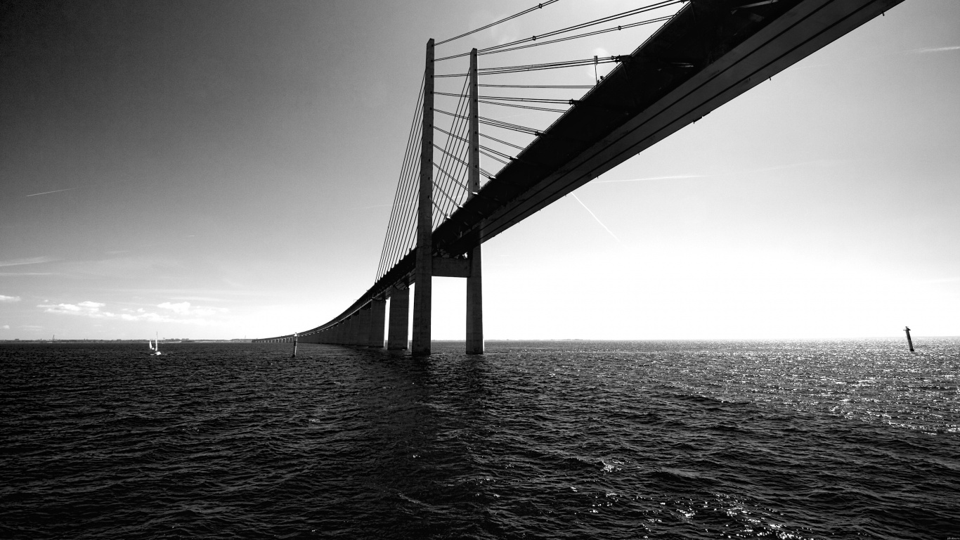 Grayscale Photo of Bridge Over Water. Wallpaper in 1366x768 Resolution