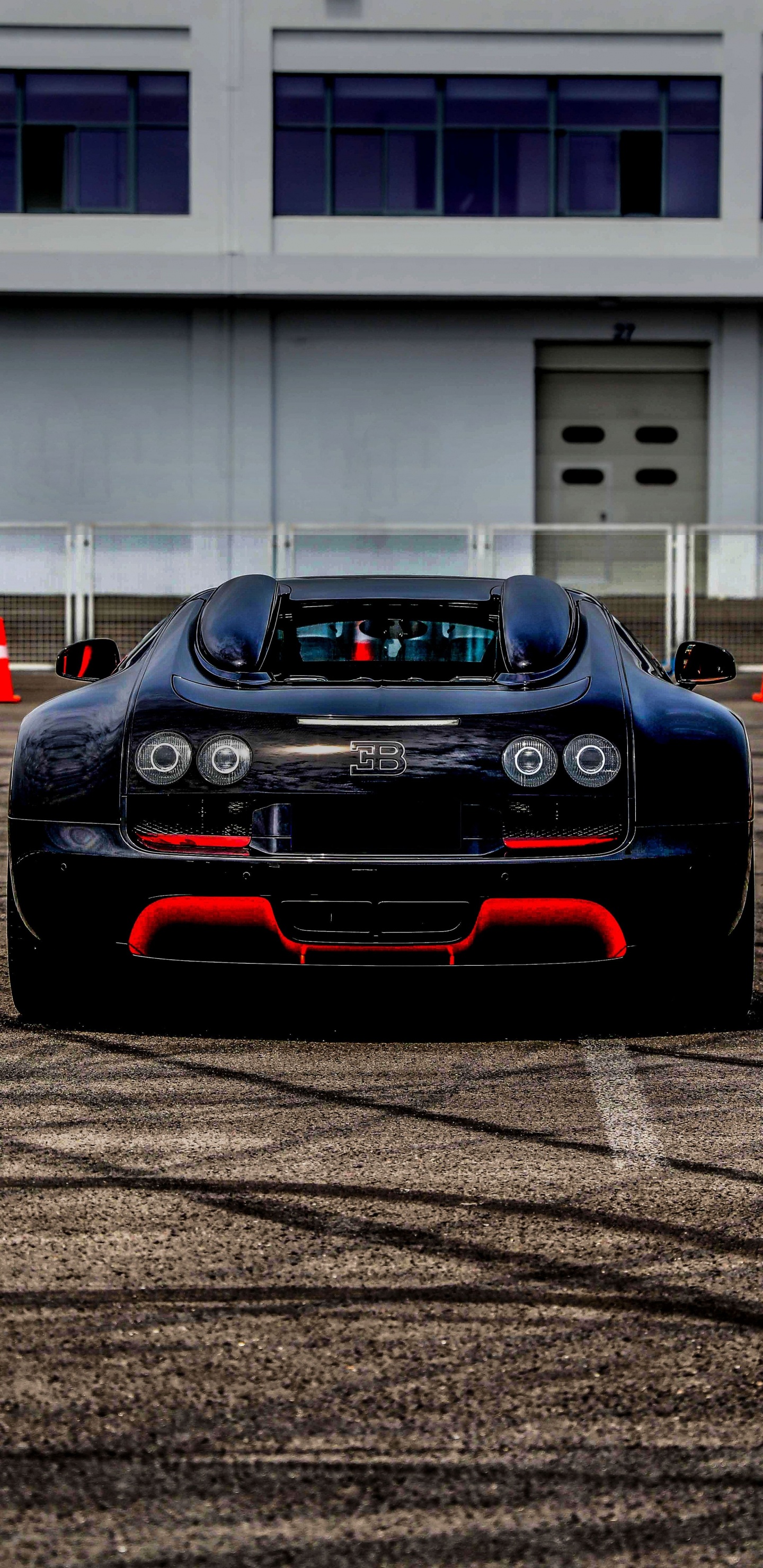 Black Porsche 911 on Road. Wallpaper in 1440x2960 Resolution