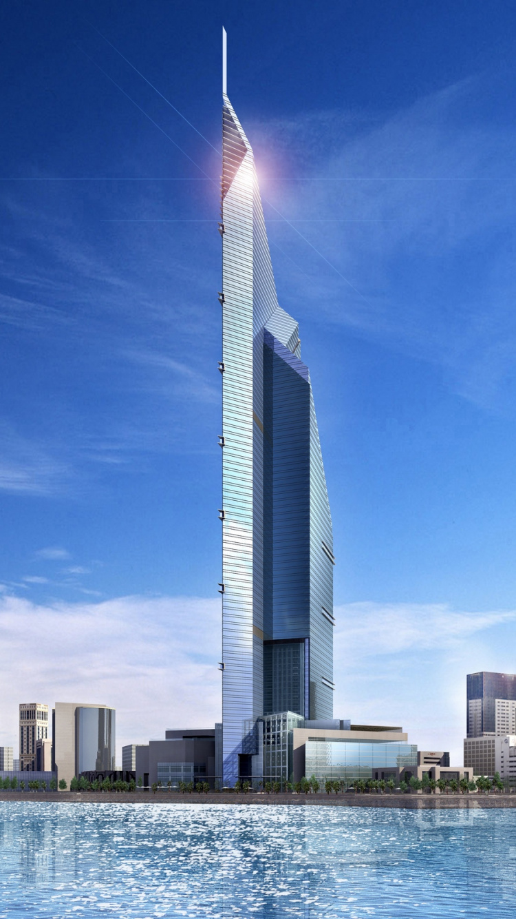 Weißes Und Graues Hochhaus in Der Nähe Eines Gewässers Tagsüber. Wallpaper in 750x1334 Resolution