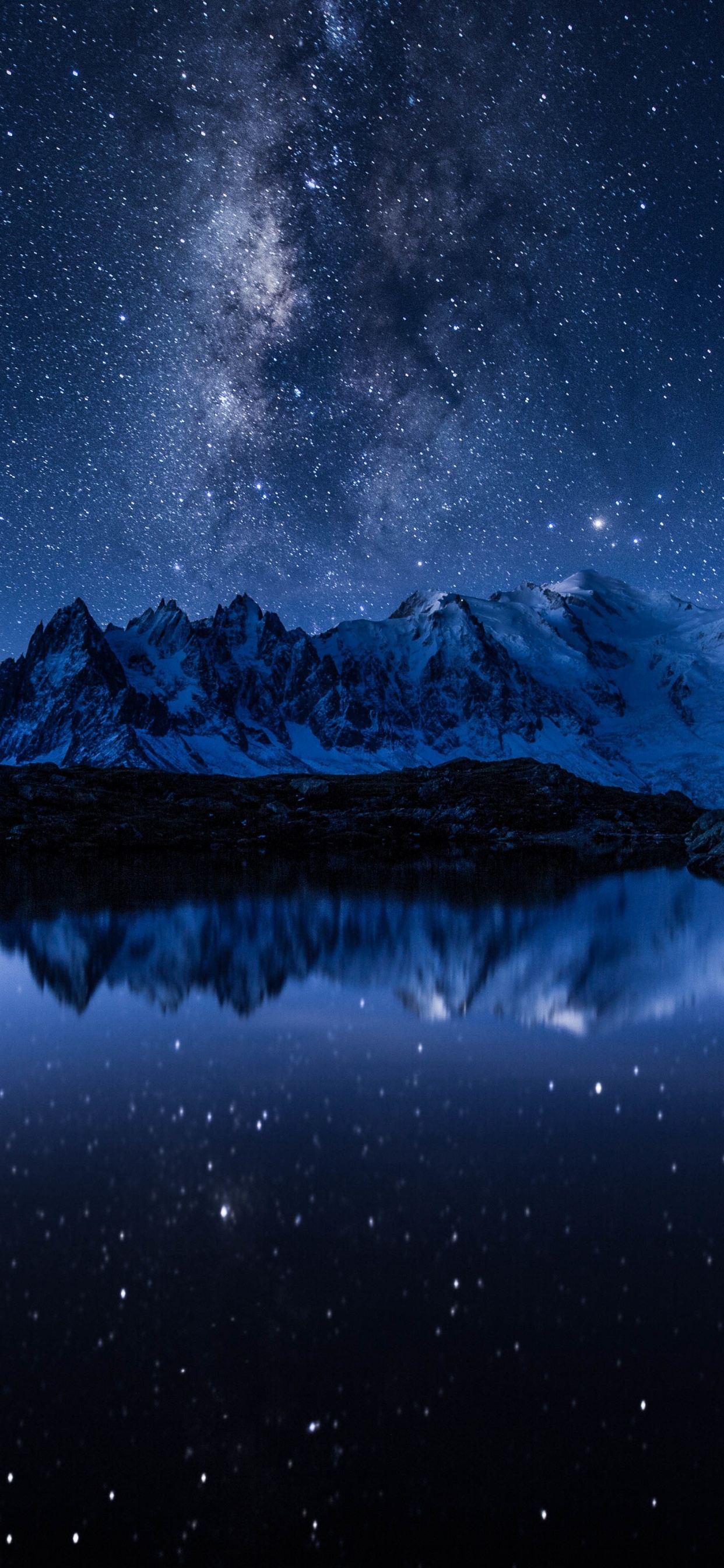 Snow Covered Mountain During Night Time. Wallpaper in 1242x2688 Resolution