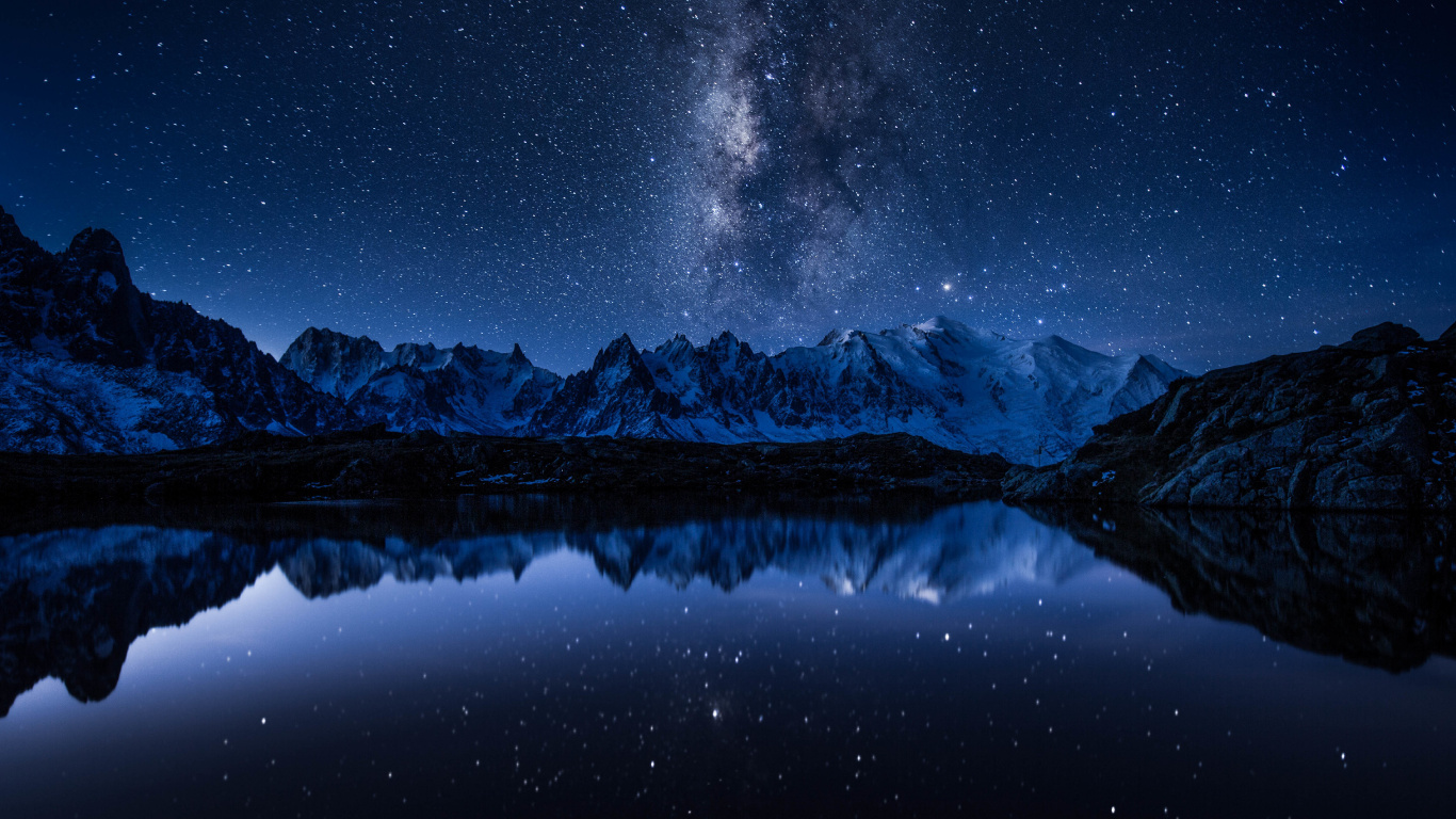 Snow Covered Mountain During Night Time. Wallpaper in 1366x768 Resolution