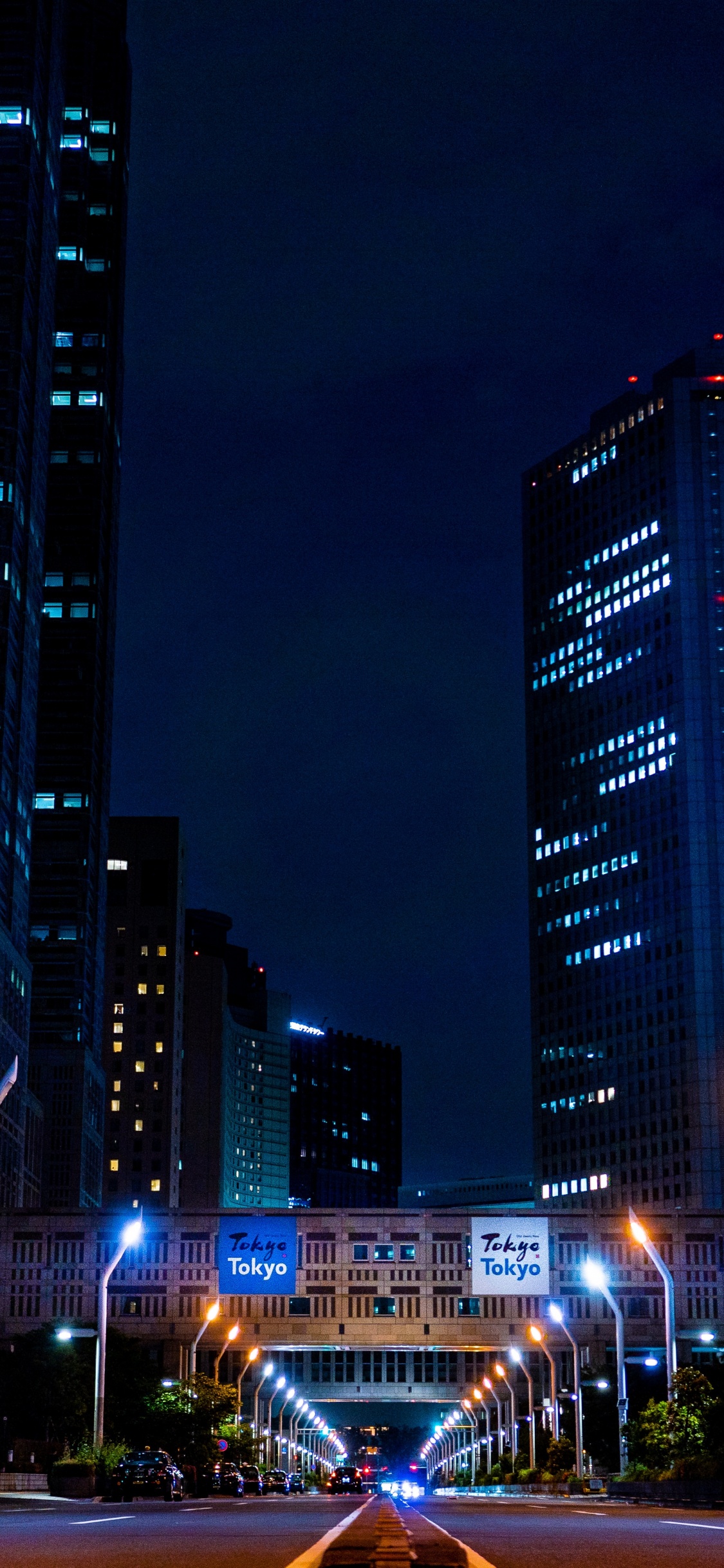 City Buildings During Night Time. Wallpaper in 1125x2436 Resolution