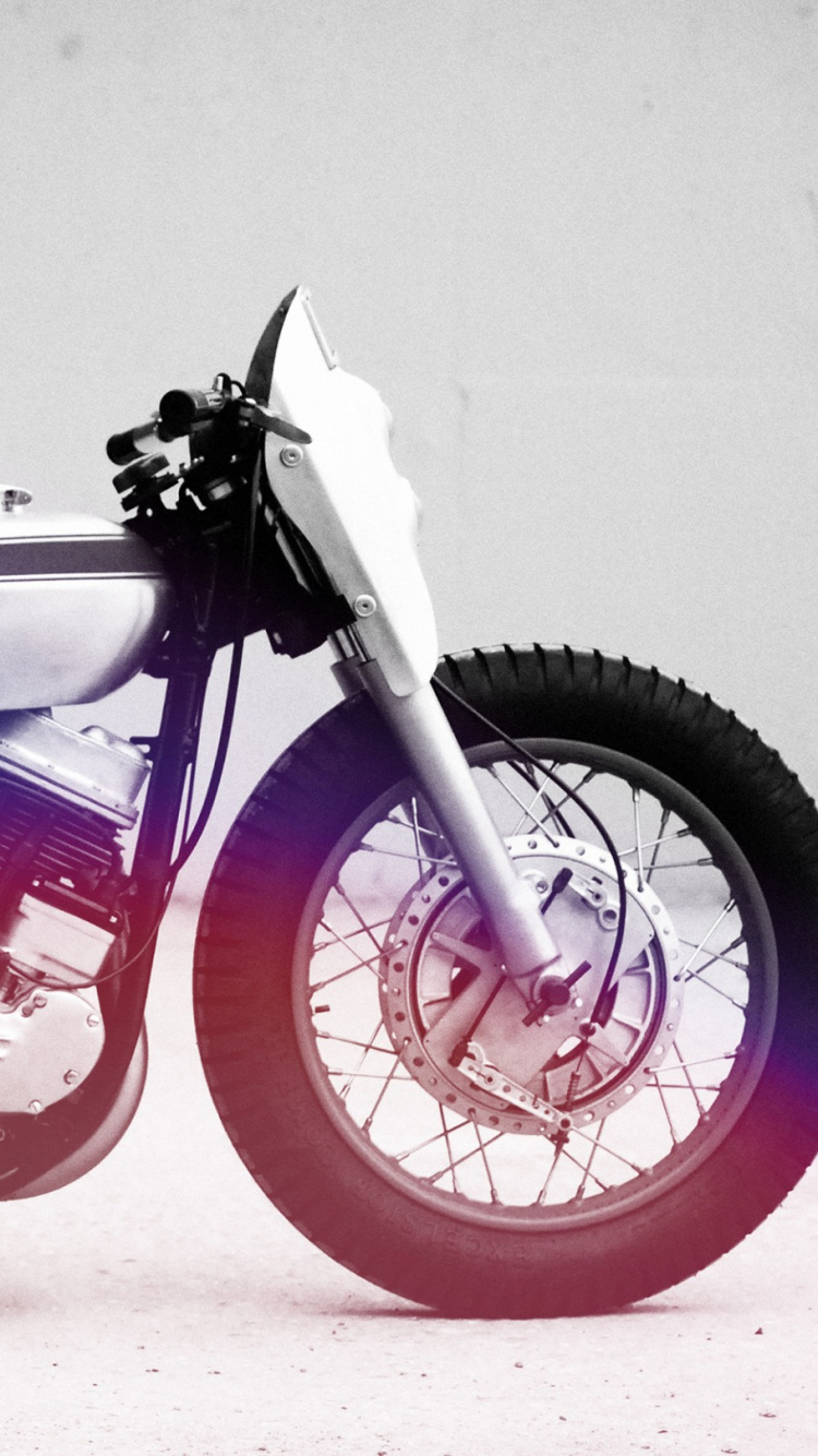 Red and Black Motorcycle With White Background. Wallpaper in 750x1334 Resolution