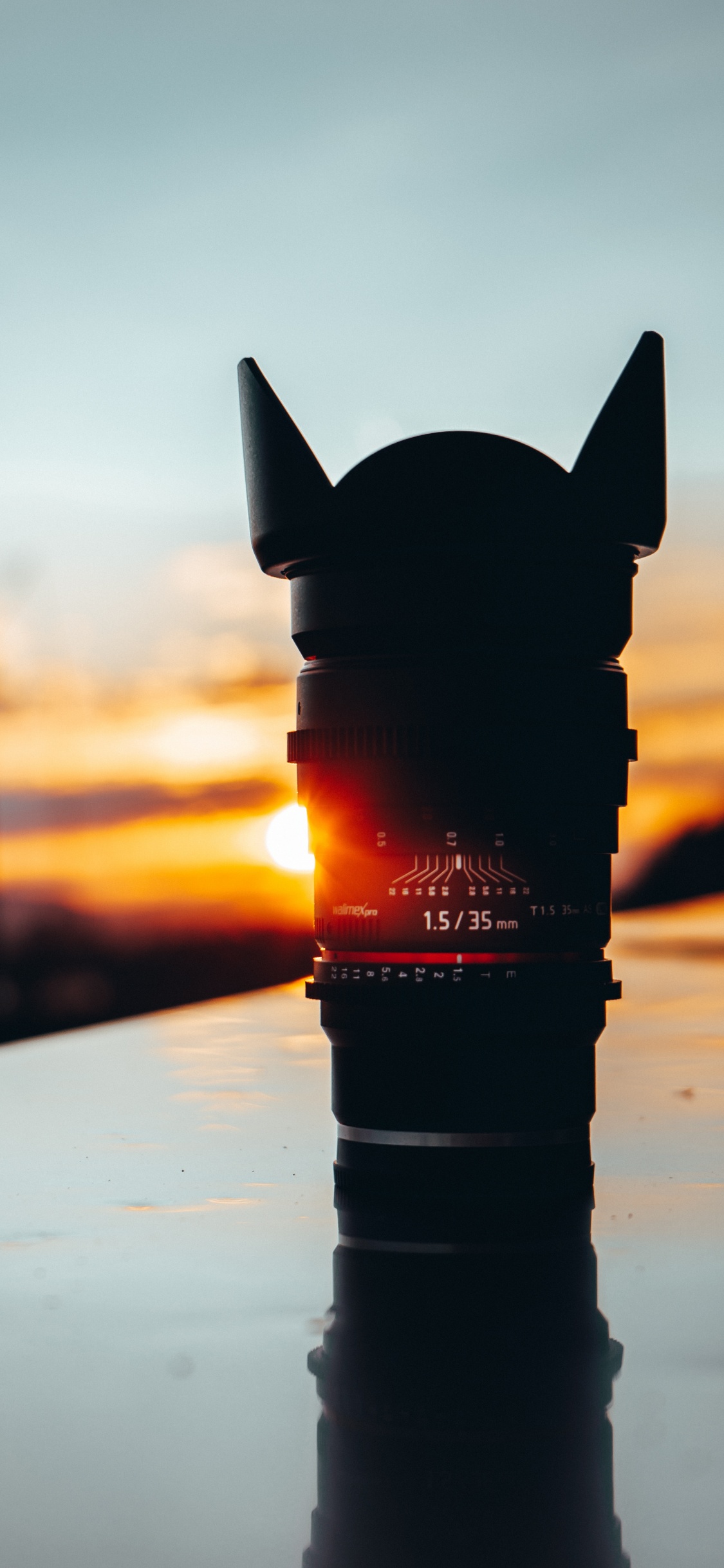 Black Dslr Camera Lens on White Table. Wallpaper in 1125x2436 Resolution