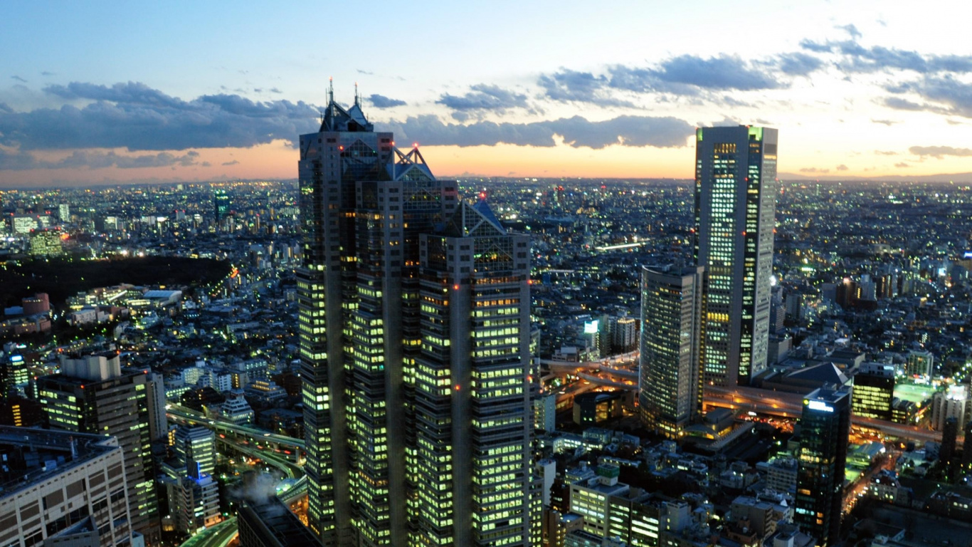Aerial View of City Buildings During Night Time. Wallpaper in 1366x768 Resolution