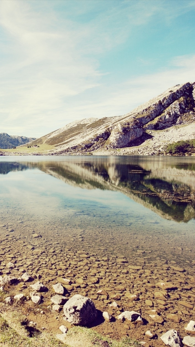 Lake in The Middle of Mountains During Daytime. Wallpaper in 750x1334 Resolution
