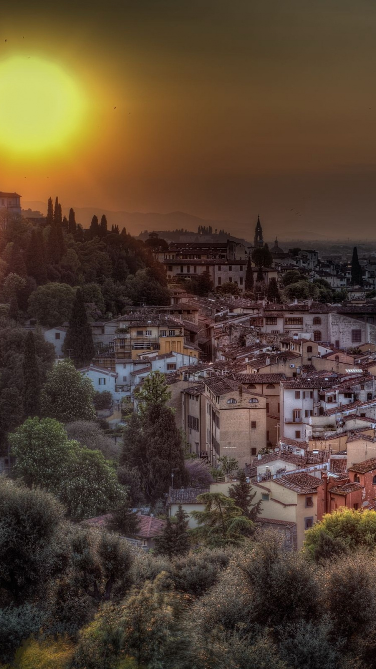 Vue Aérienne de la Ville au Coucher du Soleil. Wallpaper in 750x1334 Resolution
