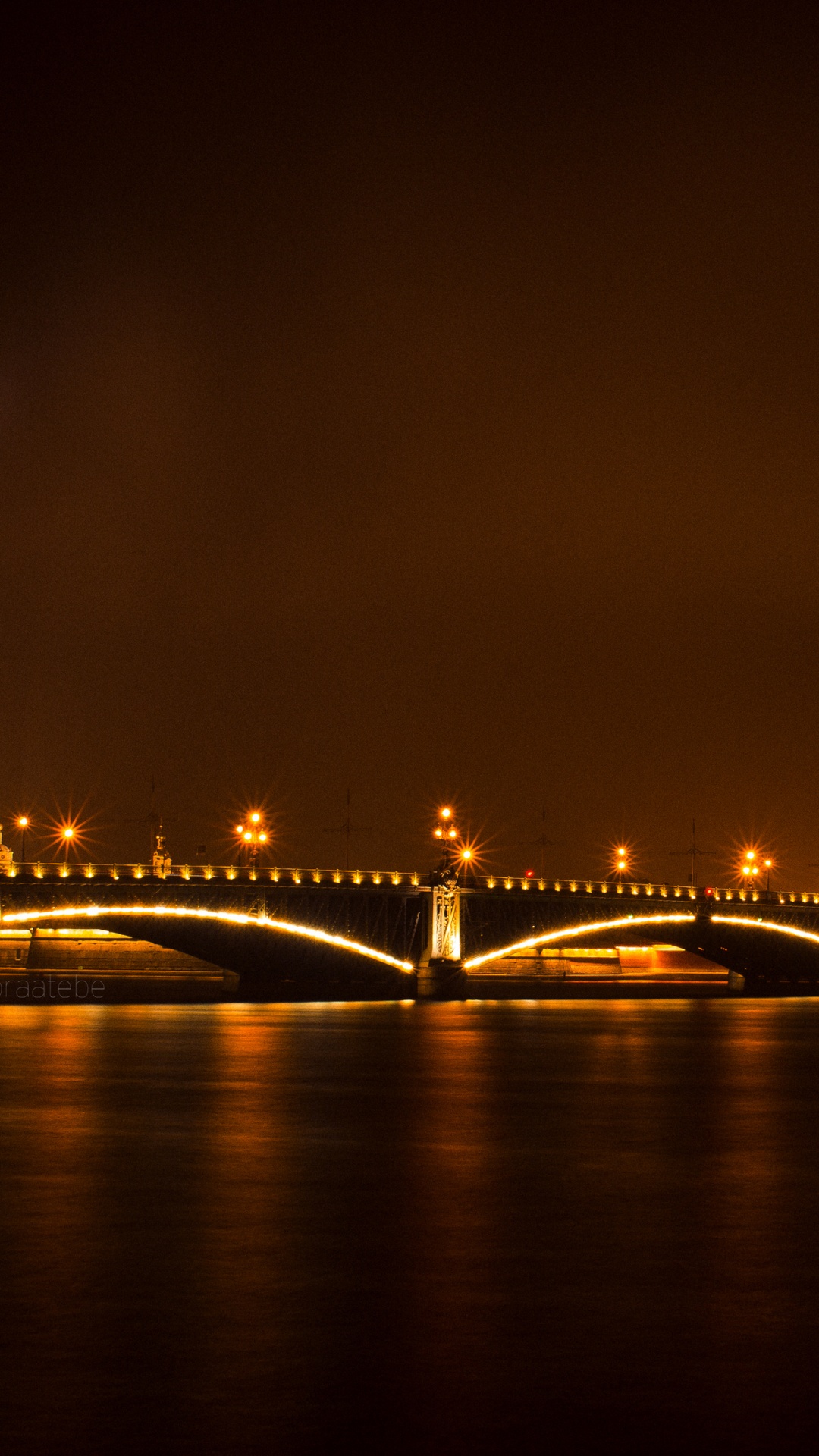 Lighted Bridge Over Body of Water During Night Time. Wallpaper in 1080x1920 Resolution