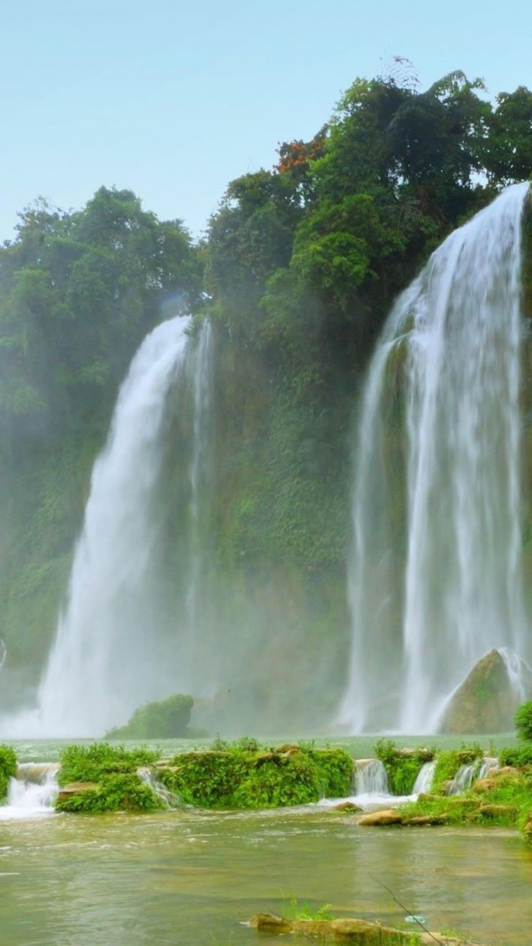 Waterfalls on Green Grass Field During Daytime. Wallpaper in 750x1334 Resolution