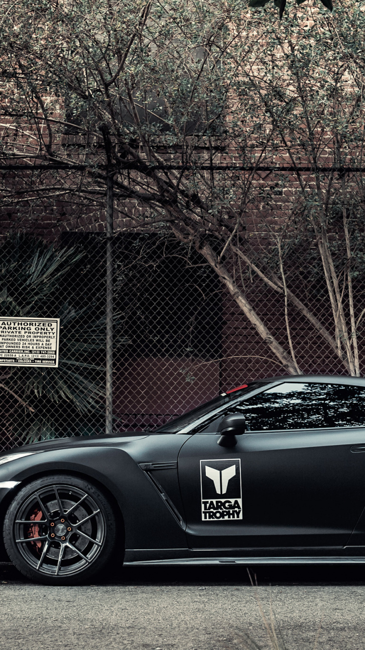 Black Porsche 911 Parked Near Brown Bare Trees During Daytime. Wallpaper in 750x1334 Resolution