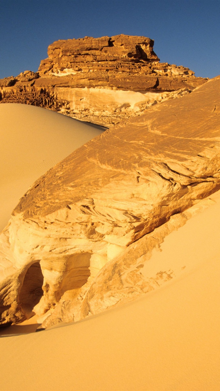 Brown Rock Formation on Body of Water During Daytime. Wallpaper in 720x1280 Resolution