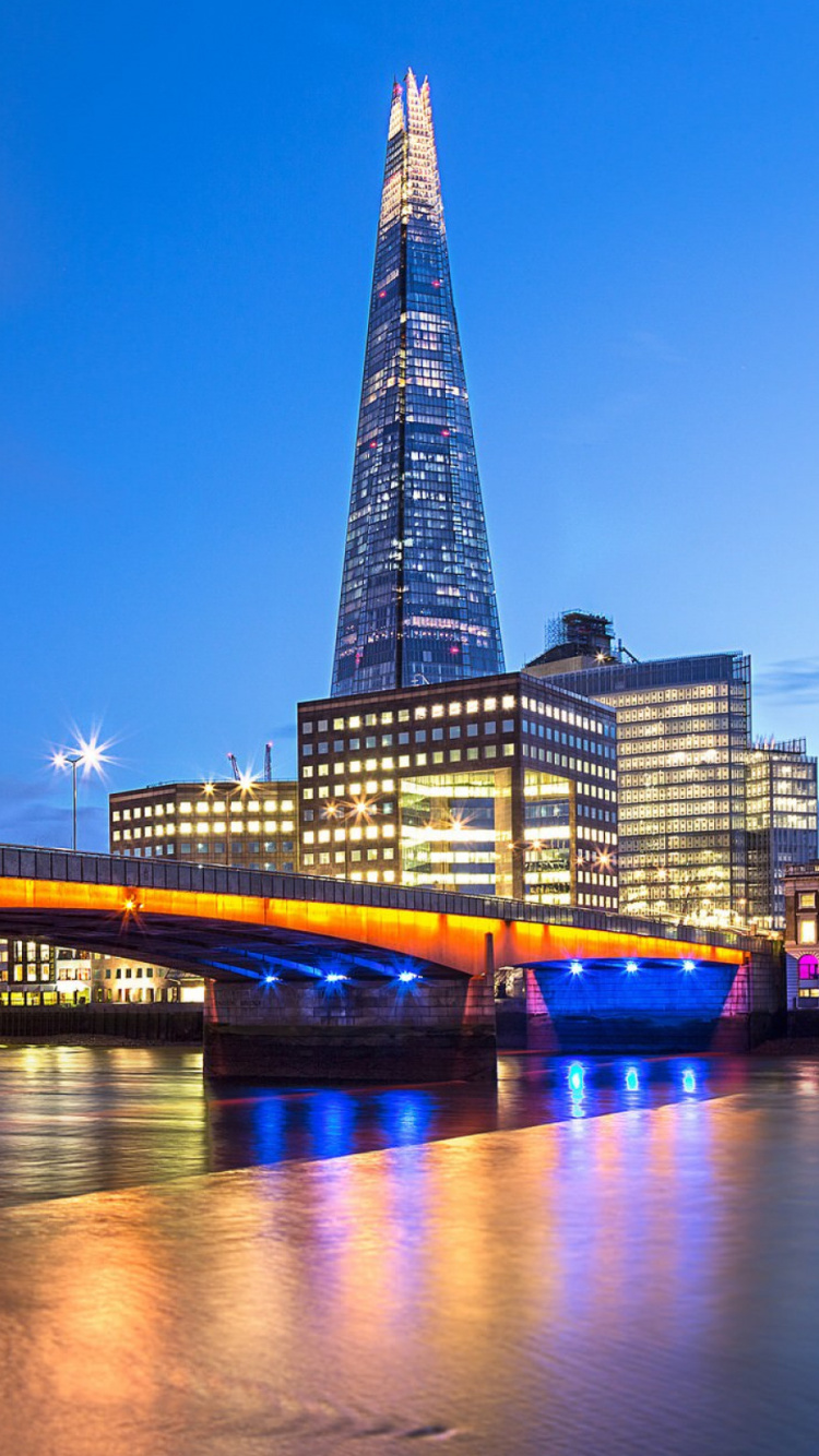 Lighted Bridge Over River During Night Time. Wallpaper in 750x1334 Resolution