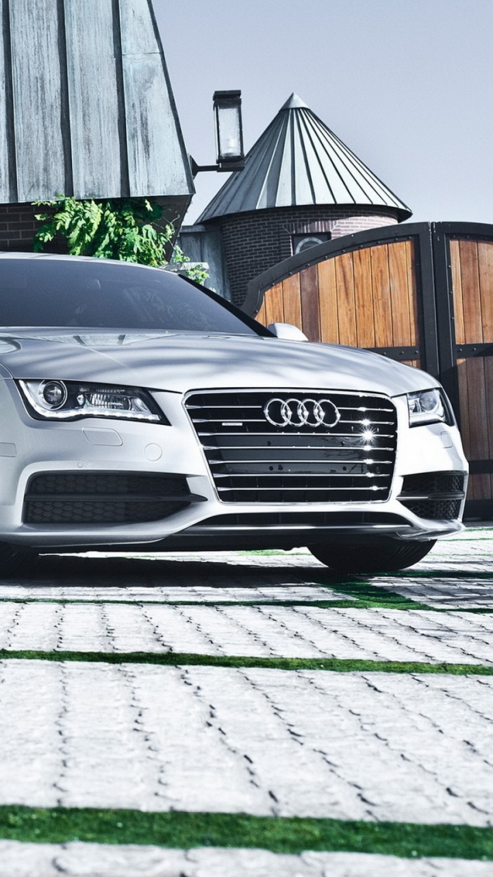 Black Mercedes Benz Coupe Parked Beside White Wall. Wallpaper in 720x1280 Resolution