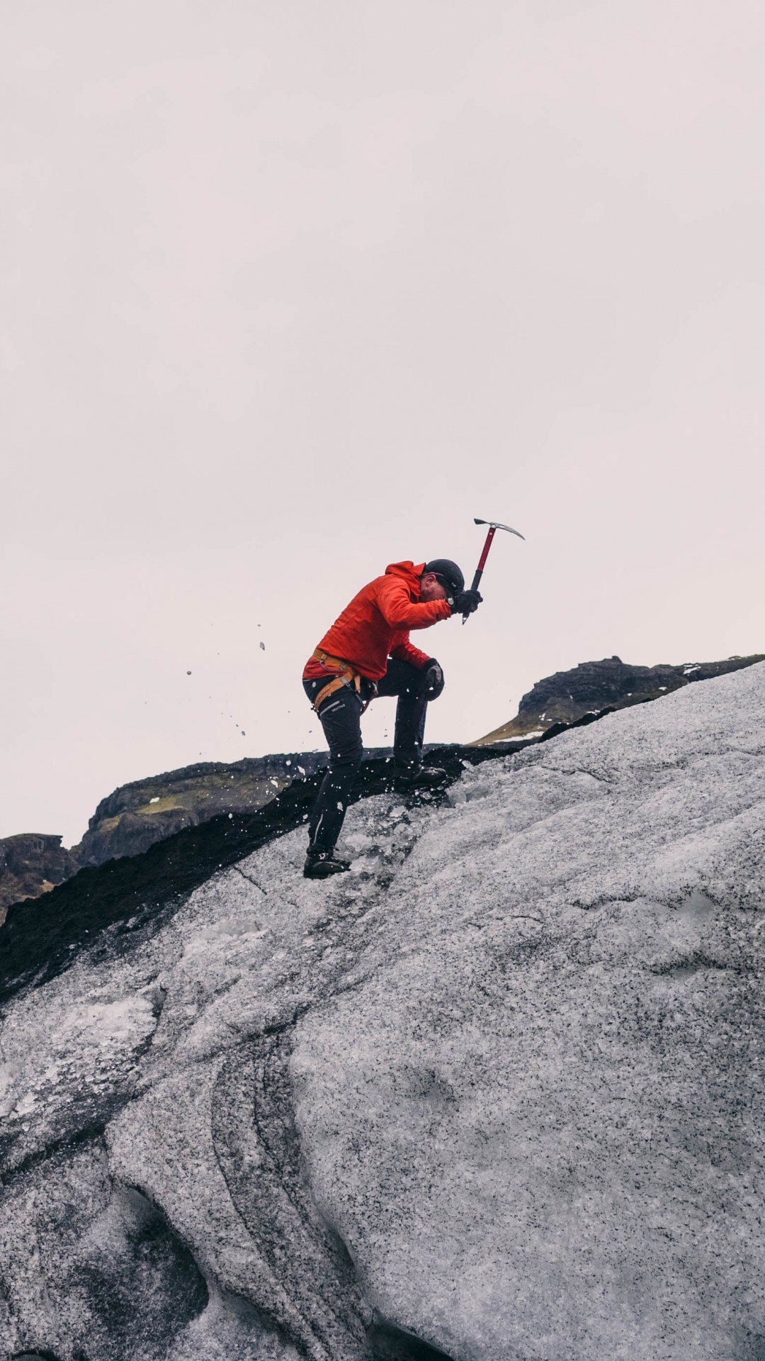 Person in Red Jacket and Black Pants Standing on Gray Rock Mountain During Daytime. Wallpaper in 1080x1920 Resolution