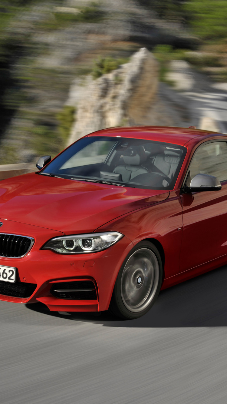 Bmw m 3 Rojo en la Carretera Durante el Día. Wallpaper in 750x1334 Resolution