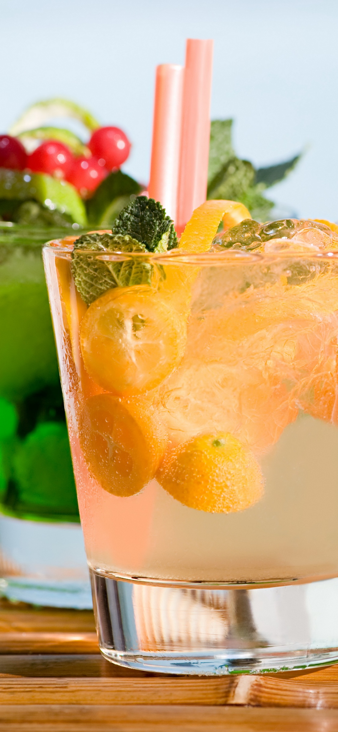 Clear Drinking Glass With Orange Juice. Wallpaper in 1125x2436 Resolution